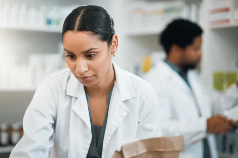 pharmacist working with coworker